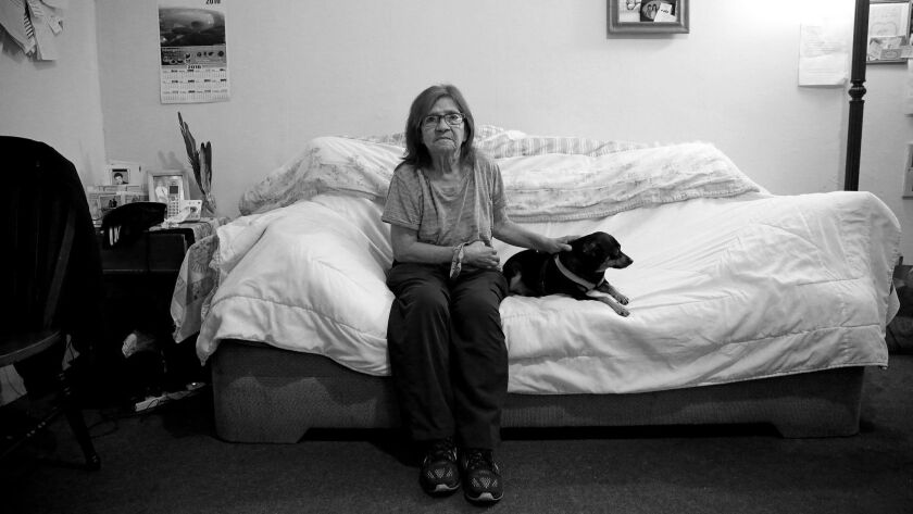 Hilda Deras, a resident of her building on South Magnolia Avenue in Los Angeles since 1977, lives alone with her dog Bella. Like others, she complained in a declaration of receiving excessive rent raises, numerous notices to enter her apartment and eviction notices.