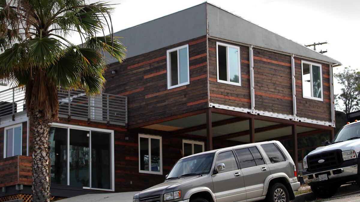 The container house is set on a steep part of Island Avenue, at the corner of 26th Street.