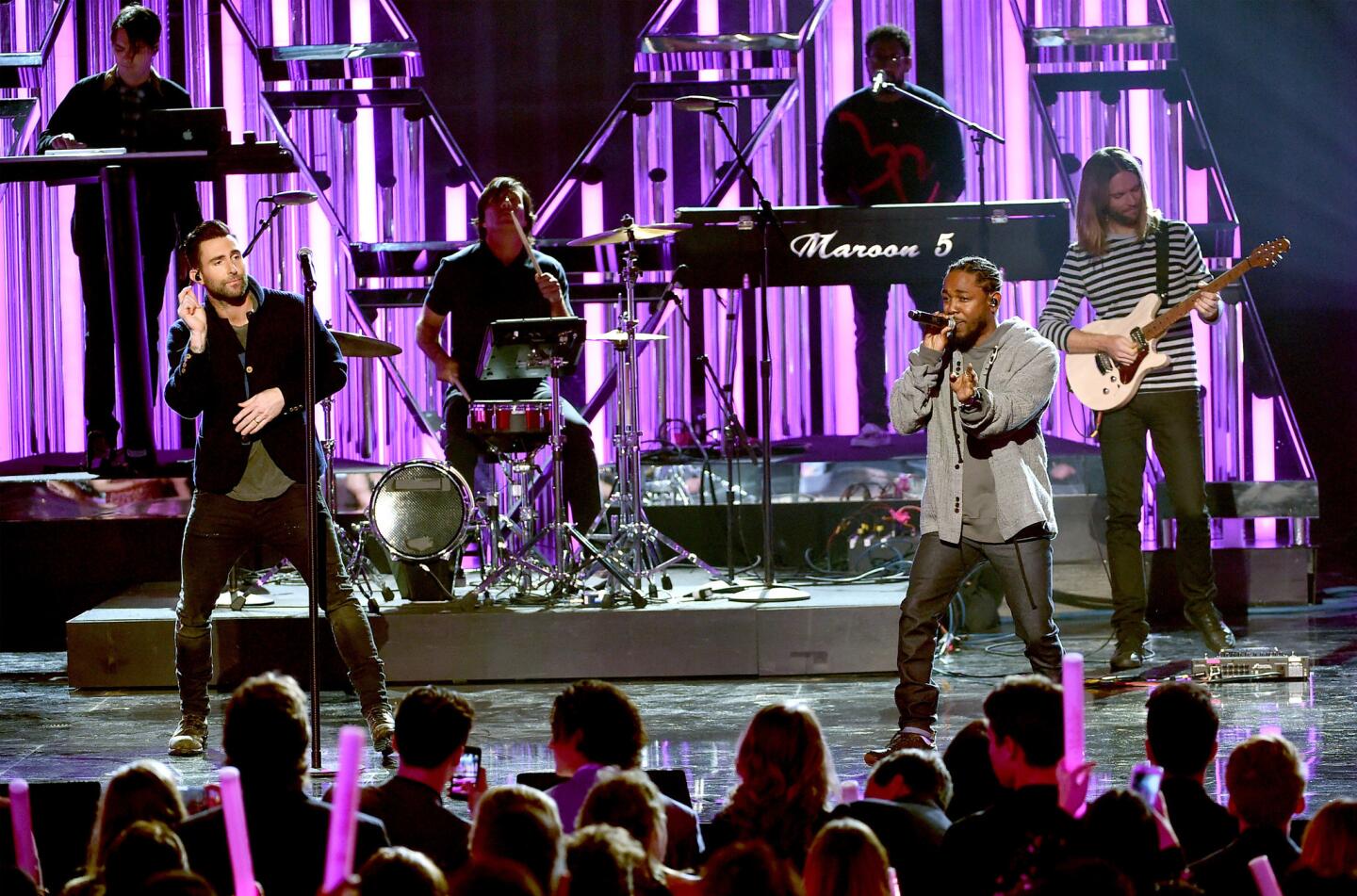 Singer Adam Levine of Maroon 5, left, and rapper Kendrick Lamar perform onstage during the 2016 American Music Awards at Microsoft Theater in Los Angeles, California.