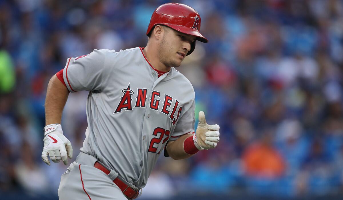 Angels outfielder Mike Trout circles the bases after hitting a solo home run against Toronto on Aug. 24.