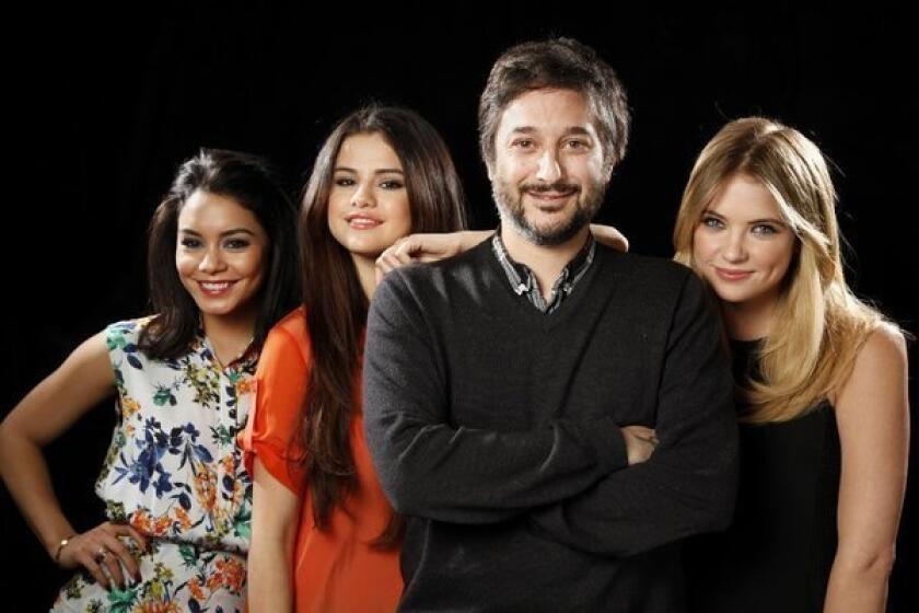 Director Harmony Korine poses for a portrait with three of his four lead actresses from his new film "Spring Breakers" at the SLS hotel. Left to right, Vanessa Hudgens, Selena Gomez and Ashley Benson.