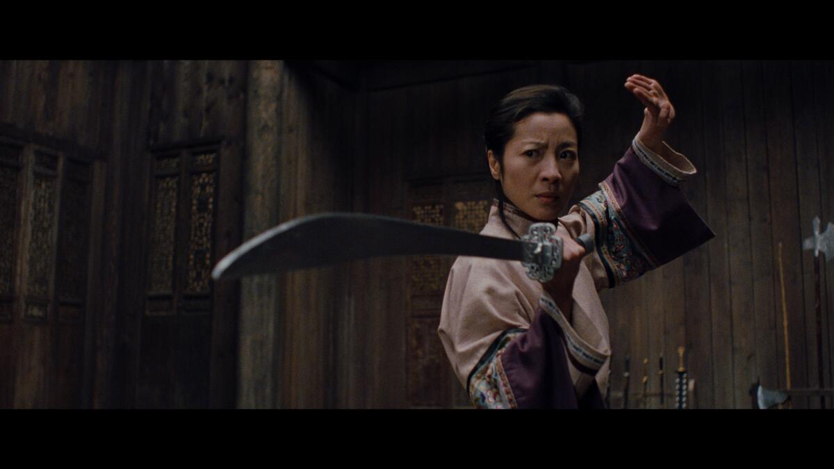 A woman armed with a weapon in the movie "Crouching Tiger, Hidden Dragon."