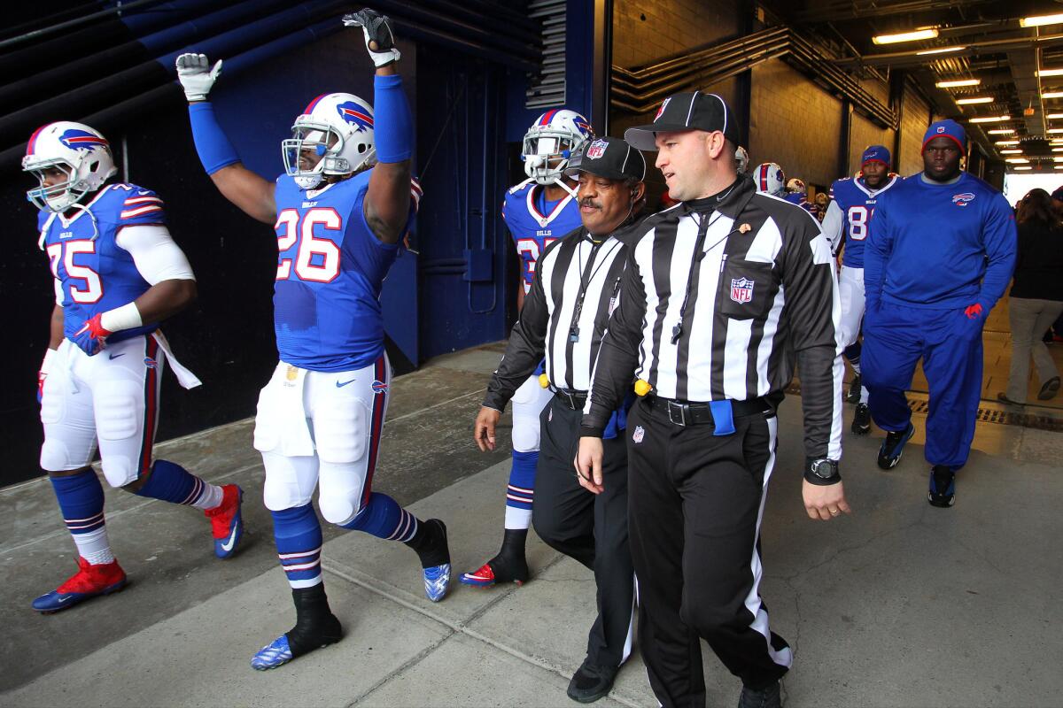 Bills running back Anthony Dixon (26) gestures to the crowd while waiting to take the field against the Texans on Dec. 6.