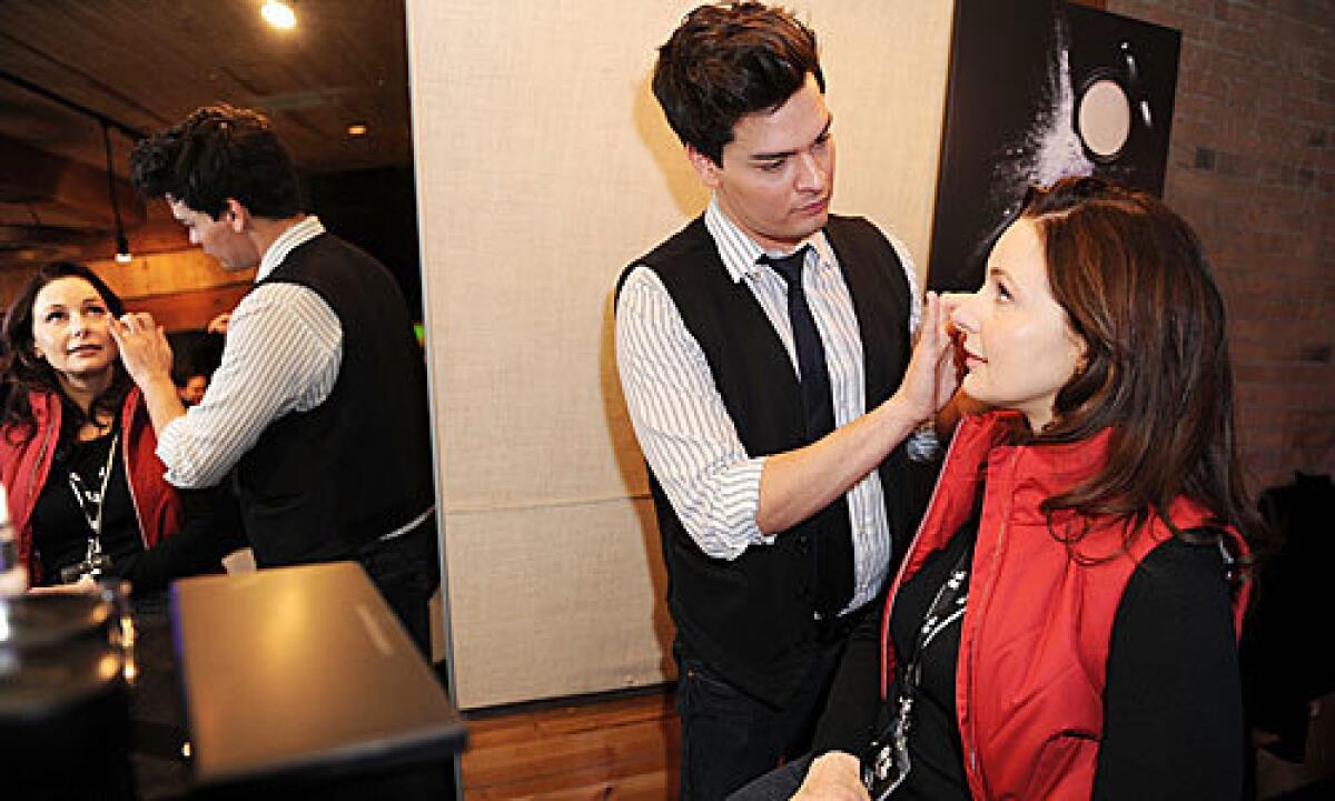 Ivan Castro of Le Metier de Beaute demonstrates his techniques on actress Elle Travis in Park City, Utah.