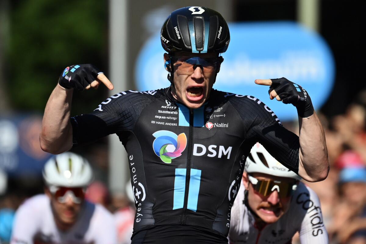 Italy's Alberto Dainese celebrates after winning the 11th stage of the Giro d’Italia cycling race, from Santarcangelo di Romagna to Reggio Emilia, Italy, Wednesday, May 18, 2022. (Massimo Paolone/LaPresse via AP)
