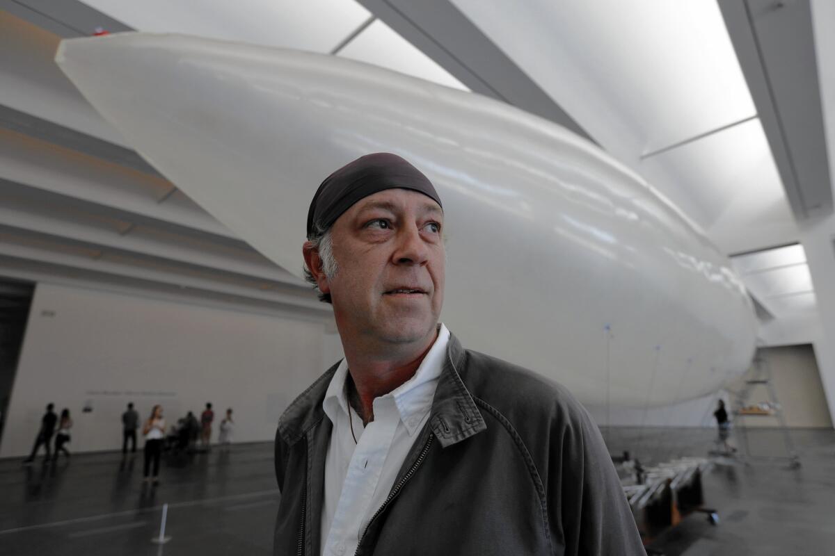 Chris Burden loved to build things; John Biggs worked shoulder to shoulder with him on a final project, "Ode to Santos Dumont." Here, John Biggs with flying installation at LACMA.