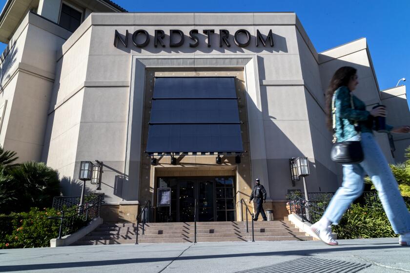 LOS ANGELES, CA - NOVEMBER 23, 2021: A security guard patrols the front entrance of Nordstrom on Tuesday after an organized group of thieves attempted a smash-and-grab robbery late Monday night at The Grove location November 23, 20201 in Los Angeles, California. (Gina Ferazzi / Los Angeles Times)