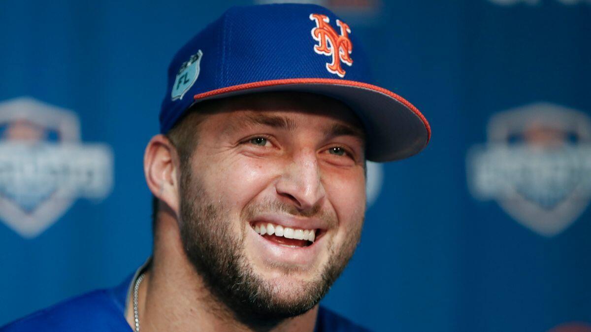Tim Tebow laughs during a news conference at the Mets' spring training facility in Port St. Lucie, Fla., on Feb. 27, 2017.