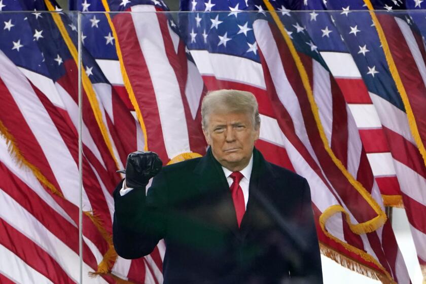 FILE - In this Jan. 6, 2021, file photo, then-President Donald Trump gestures as he arrives to speak at a rally in Washington. Trump will return to the rally stage this weekend. He's holding his first campaign-style event since leaving the White House as he makes good on his pledge to exact revenge on those who voted for his historic second impeachment.(AP Photo/Jacquelyn Martin, File)