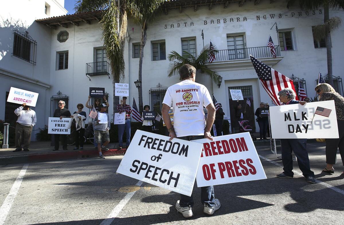 Protesting outside the Santa Barbara News Press