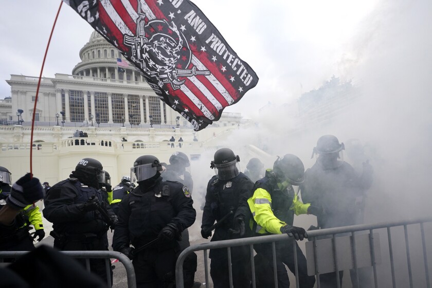 U.S. Capitol Police officers holding off rioters