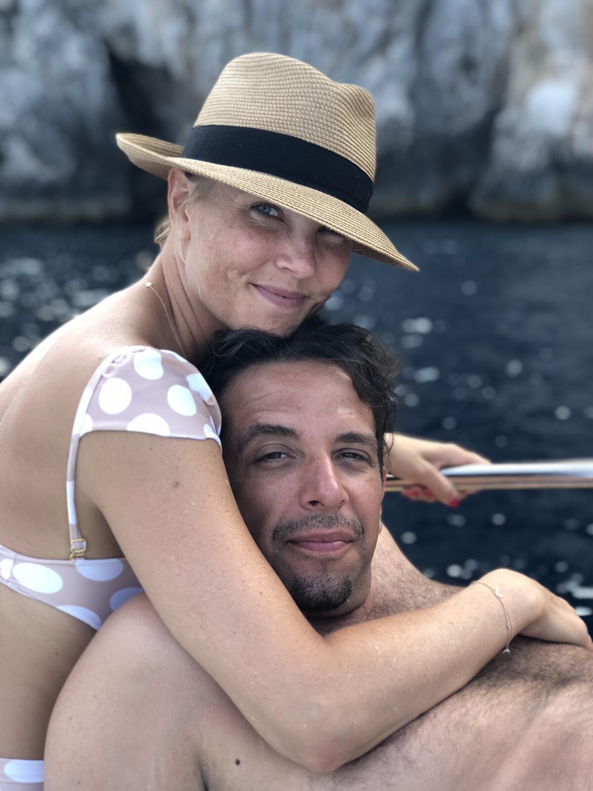 A close-up photo of a couple on a boat