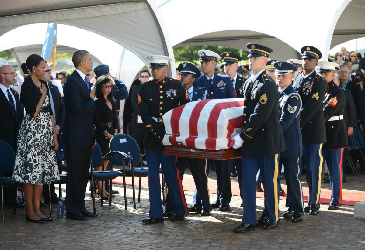President Obama and First Lady Michelle Obama at Sen. Daniel Inouye's funeral in 2012 at the National Memorial Cemetery of the Pacific in Honolulu, home to the unidentified remains of those killed in the attack on Pearl Harbor.