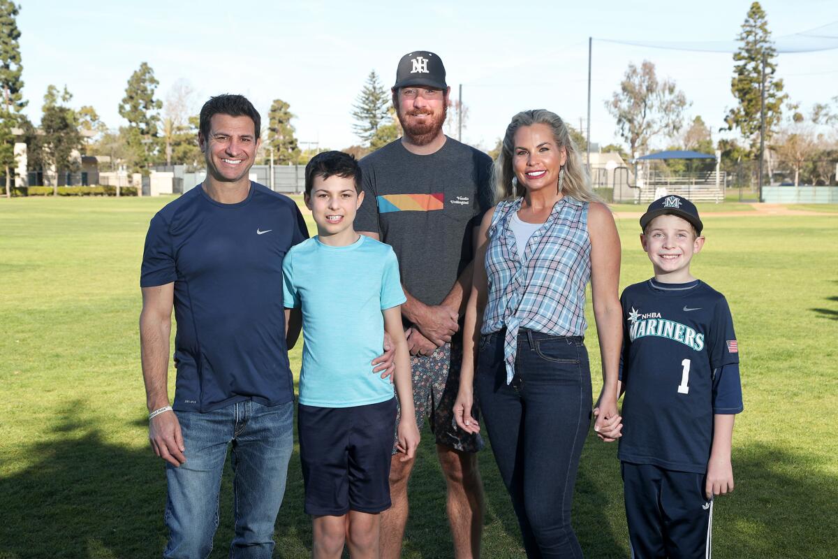 Newport Harbor Baseball Assn. President Jared Eisenberg with the Tarman family: Dan, son, Leo, wife, Alicia, and son, Miles.