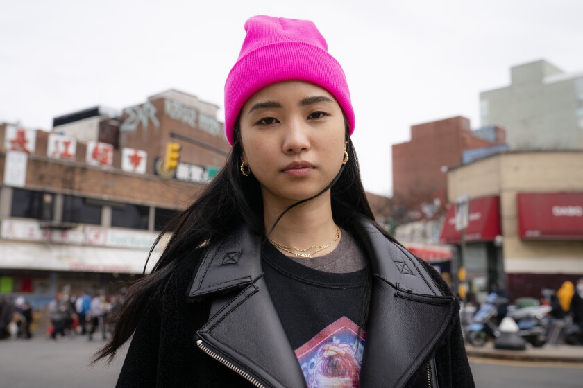 Teresa Ting stands for a portrait, Wednesday, March 31, 2021, in the Flushing neighborhood of the Queens borough of New York. The vicious assault of a 65-year-old woman while walking to church this week near New York City’s Times Square has heightened already palpable levels of outrage over anti-Asian attacks that started with the pandemic. Ting, a 29-year-old Chinese American, started what has become the Main Street Patrol following an attack on another older Asian American woman in February. “It literally could have been my mother had it been the wrong place, wrong time," Ting said of that attack. (AP Photo/John Minchillo)