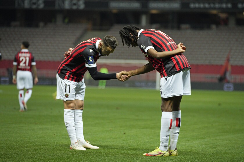Nice's Khephren Thuram, right, celebrates with Amine Gouiriafter after scoring his side's second goal during a French League One soccer match between Nice and Nantes at the Allianz Riviera stadium in Nice, France, Saturday, Jan. 15, 2022. (AP Photo/Daniel Cole)