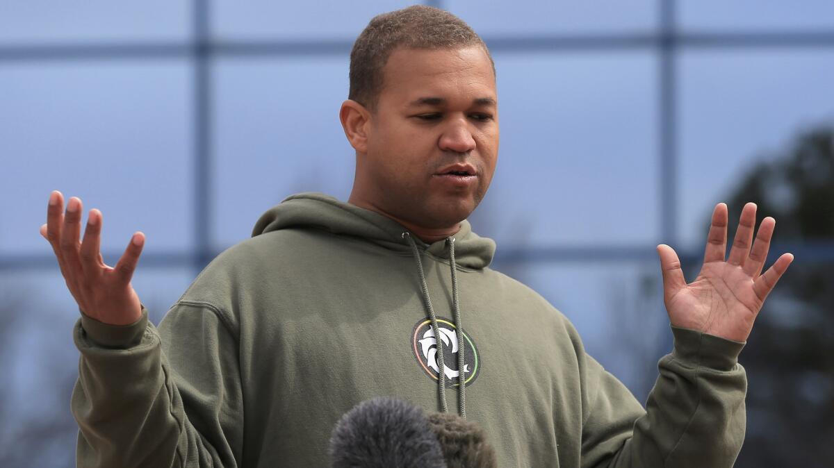 Aurora shooting victim Marcus Weaver talks to the media outside a Colorado courthouse.