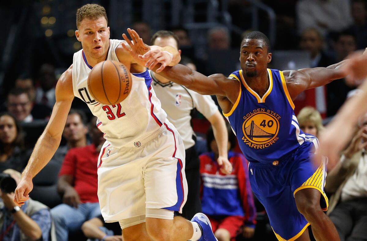 Blake Griffin battles for a loose ball with Golden State's Harrison Barnes on Thursday.