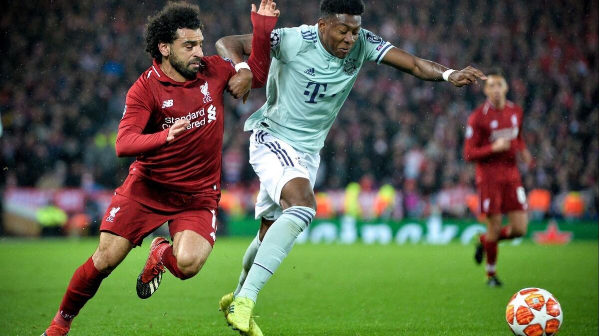 Liverpool's Mohamed Salah and Bayern Munich's David Alaba vie for the ball during a Champions League game Feb. 19.