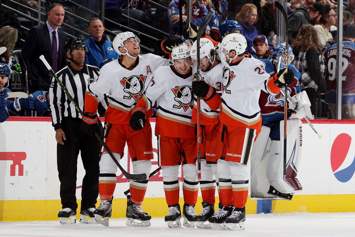 Frank Vatrano (77) celebrates with his Ducks teammates after a 5-3 victory over the Colorado Avalanche.