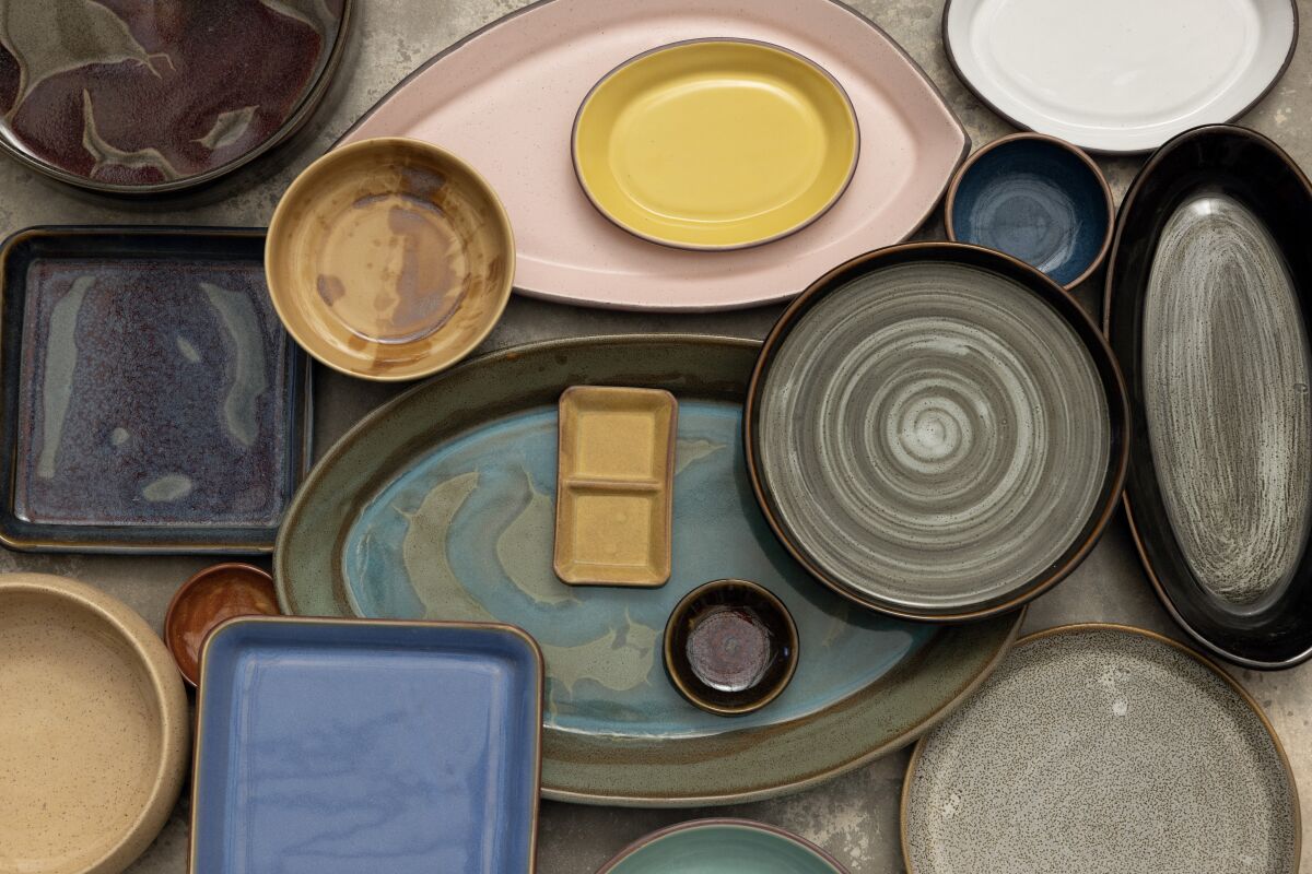 The handmade dishes at The Wheel Stoneware have a distinctive look and texture, with a variety of glazes.