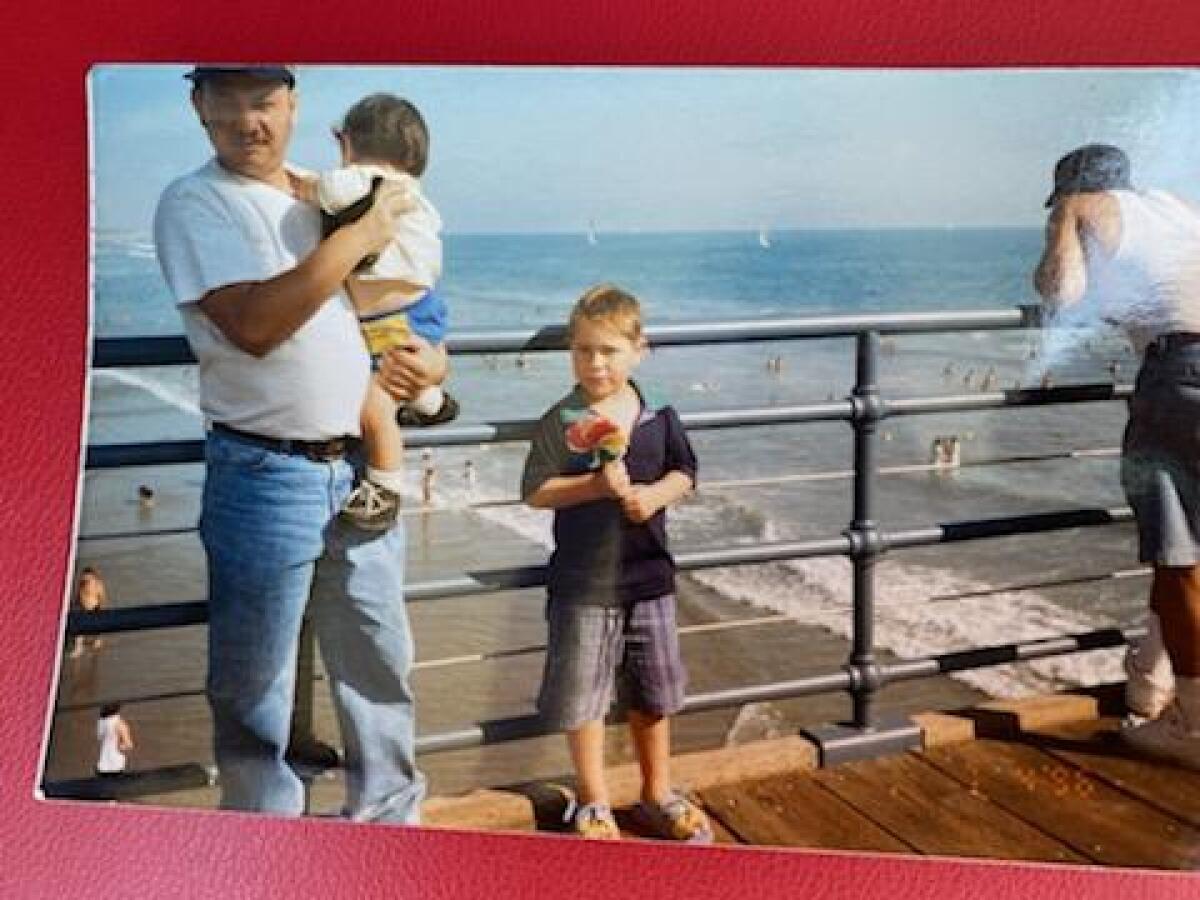 Carlos Ernesto Escobar Mejia with two of his nephews about 20 years ago.