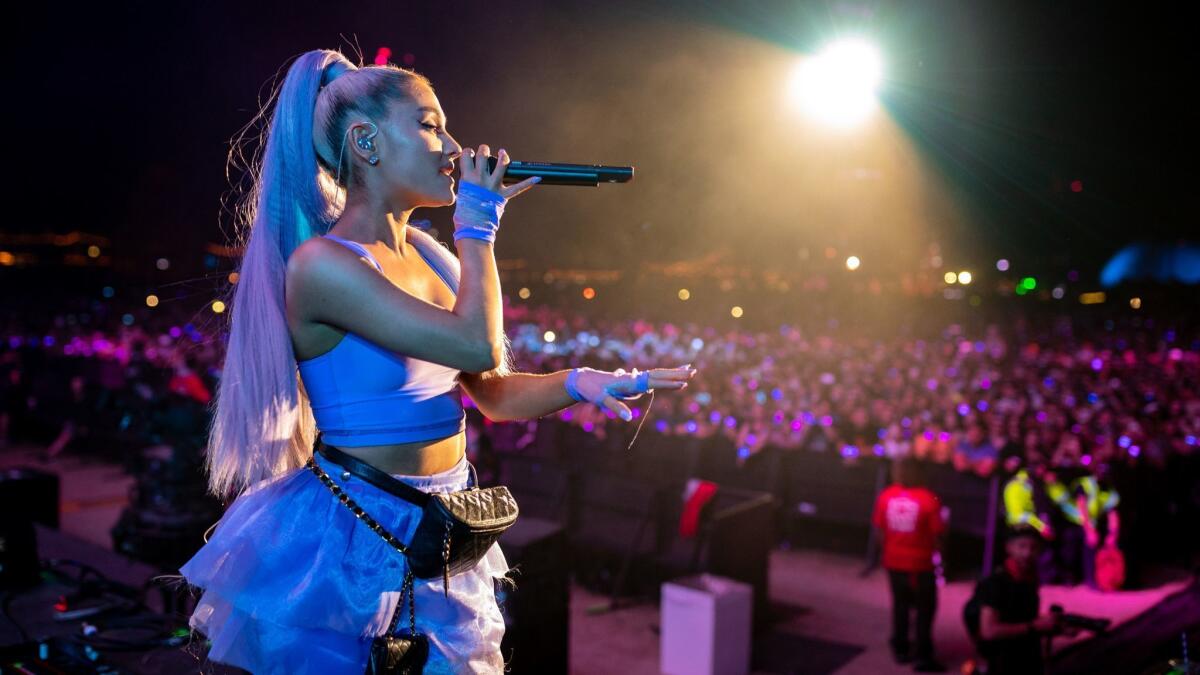 Ariana Grande performs at the Coachella Valley Music and Arts Festival. She fits many of the criteria that computers used to recognize successful songs.
