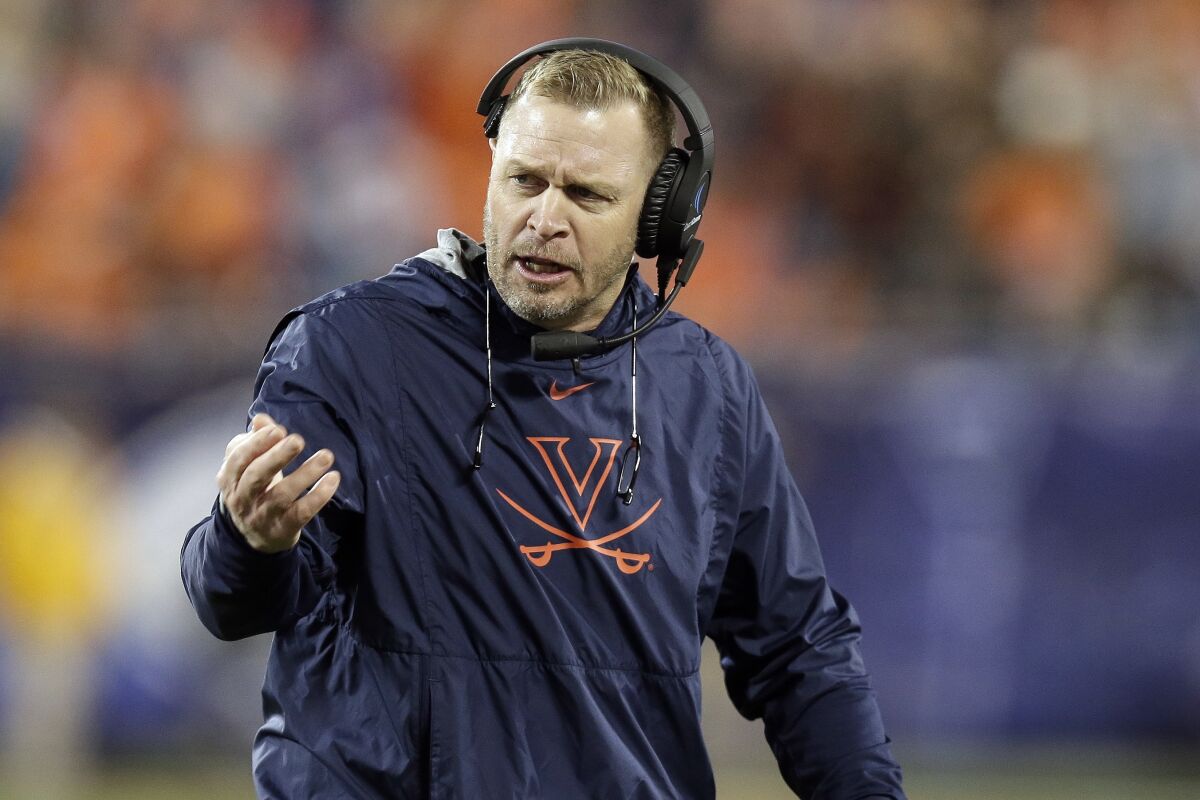 Virginia coach Bronco Mendenhall talks on the sideline.