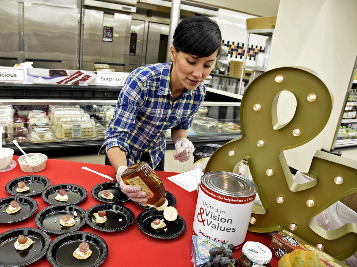 Naomi Robinson of Baker's Royale prepares hors d'oeuvres during a 2016 cooking demonstration at Smart & Final Extra! in Burbank.