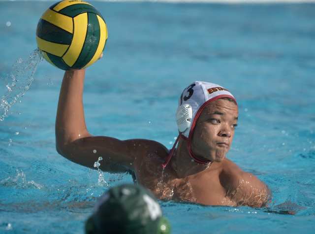 Paul Sugano-Dyson (13) of Estancia brings the ball up to make a shot against Costa Mesa during the Battle for the Bell.