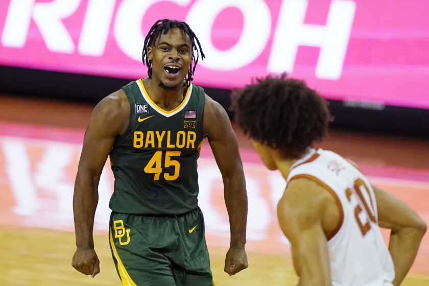 Baylor guard Davion Mitchell (45) celebrates a score against Texas during the second half of an NCAA college basketball game Tuesday, Feb. 2, 2021, in Austin, Texas. (AP Photo/Eric Gay)