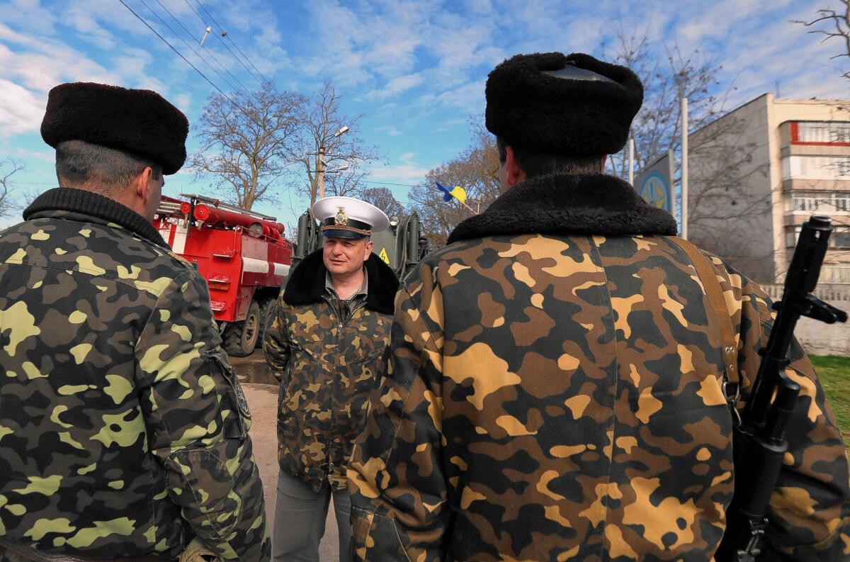 Ukrainian Col. Igor Bedzay gives instructions to his soldiers in Crimea.