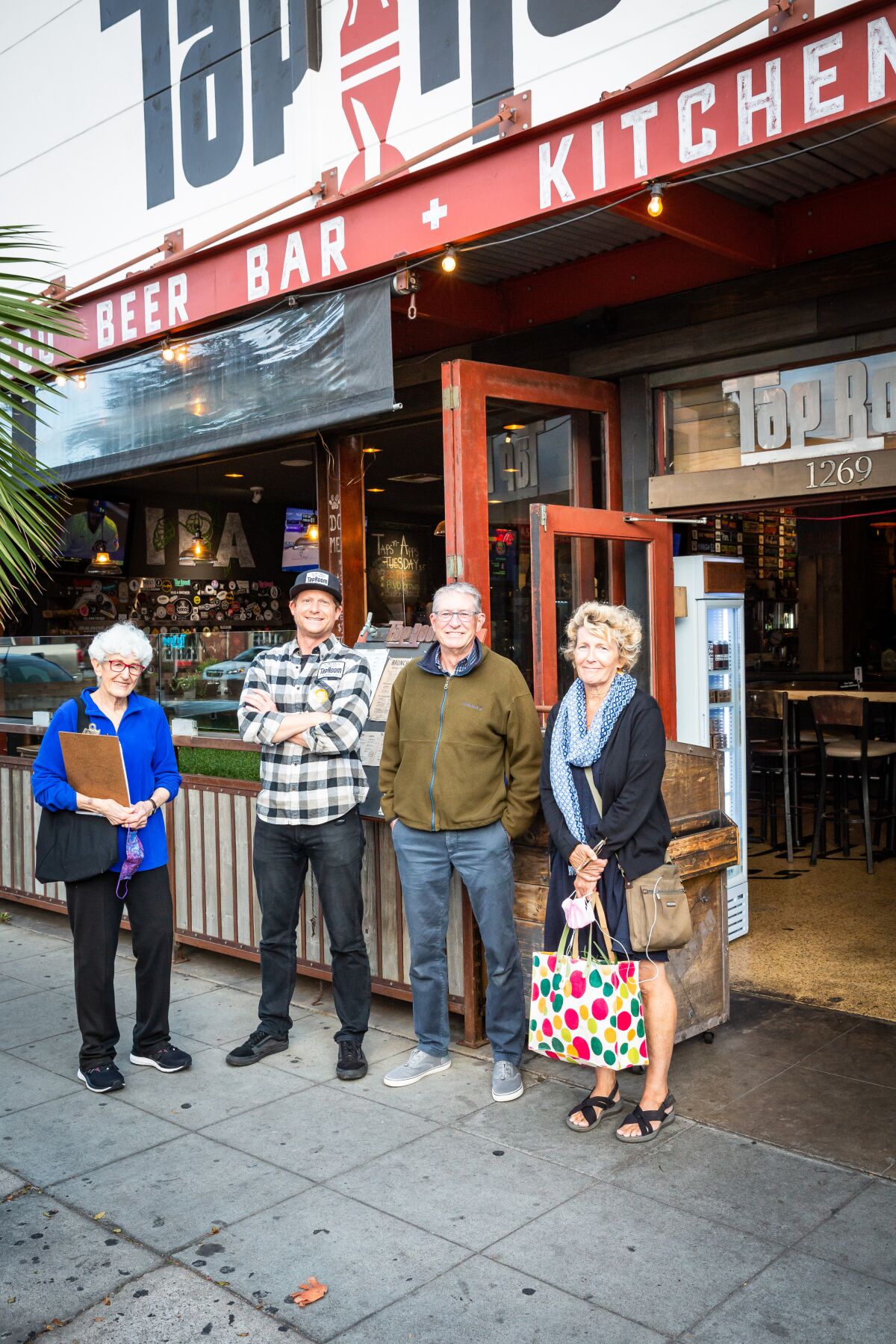 Tom Leonard, partner at SD TapRoom, second from left, with Eve Anderson, Ron Walker and Leslie Dufour, is a block captain.