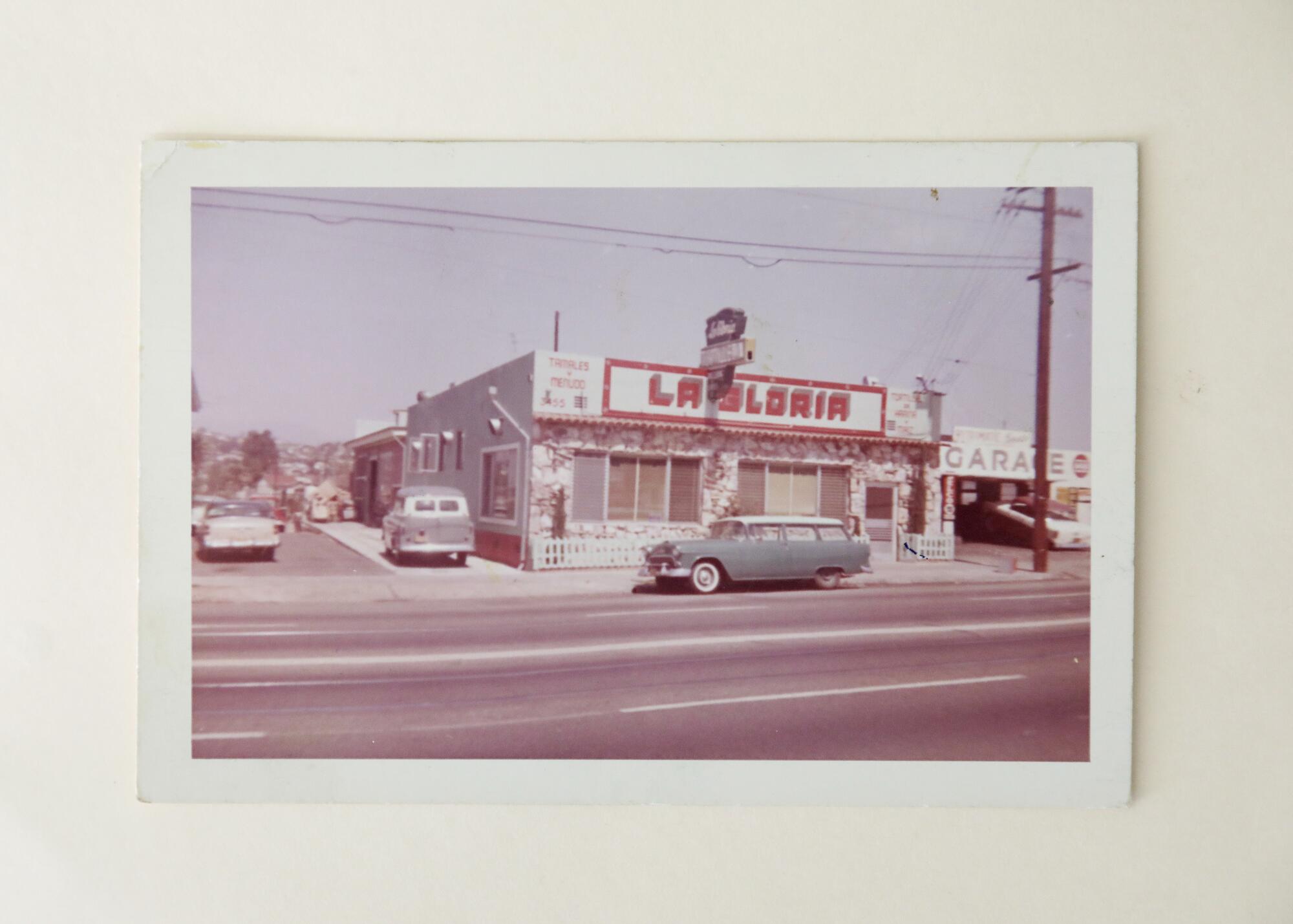 A 1960s photo shows the exterior of a building with the sign "La Gloria"