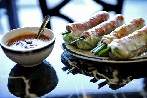 Dat Thanh's spring rolls, made with homemade shrimp or pork sausage, fresh leaf lettuce, fresh herbs, sliced cucumbers, pickled carrots, and mini wontons, are served with a homemade dipping sauce that has more than 14 ingredients.