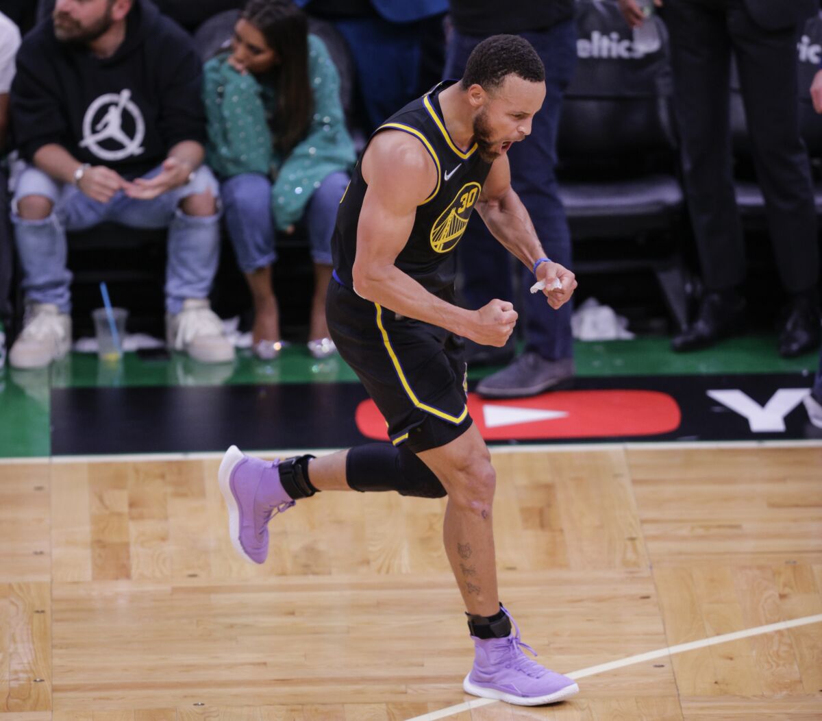 Golden State Warriors' Stephen Curry, 30, reacts after hitting a three pointer during the fourth quarter of Game 4 of basketball's NBA Finals, in Boston, Mass., on Friday, June 10, 2022. (Carlos Avila Gonzalez/San Francisco Chronicle via AP)