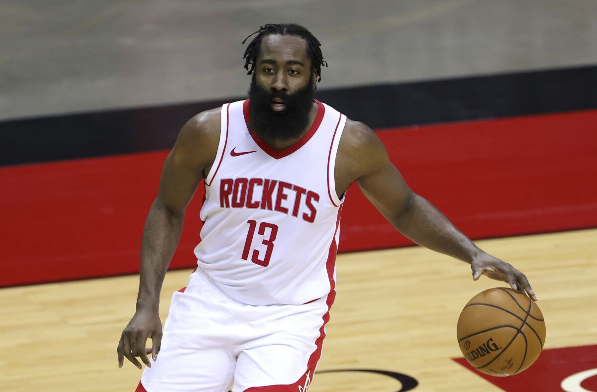Houston Rockets' James Harden controls the ball during the first half against the San Antonio Spurs.