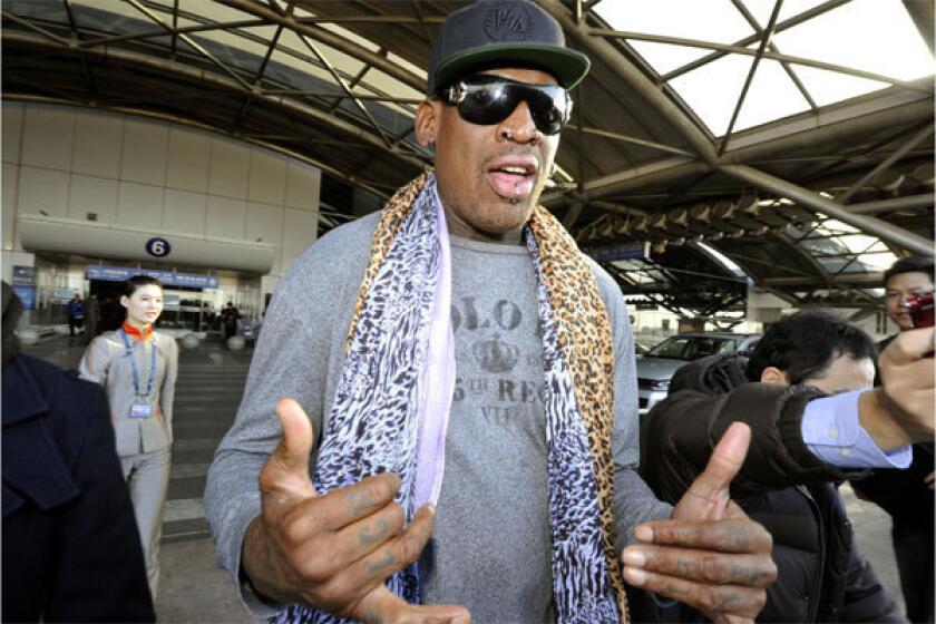 Former NBA star Dennis Rodman speaks to journalists upon arrival at the capital airport in Beijing from Pyongyang, North Korea, on Monday.