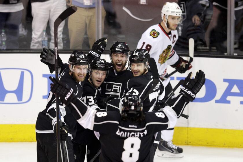 The Kings celebrate a goal by defenseman Jake Muzzin in the first period of Game 4 of the Western Conference finals against the Chicago Blackhawks at Staples Center.