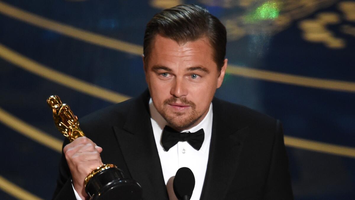 Leonardo DiCaprio accepts the lead actor award for "The Revenant."