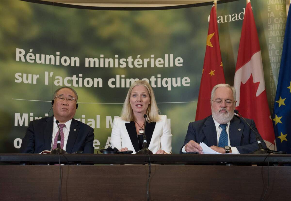 From left: China's representative on climate change Xie Zhenhua, Canadian Environment Minister Catherine McKenna and European Union Commissioner for Climate Change and Energy, Miguel Arias Canete, speak to the press after a ministerial meeting on Sept. 16, 2017 in Montreal to push forward on implementing the Paris climate accord without the United States, three months after President Donald Trump walked out on the deal.