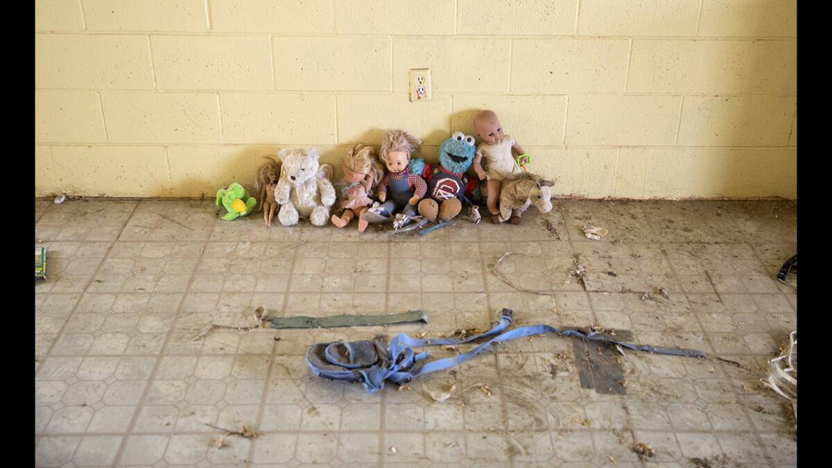 Abandoned children's toys are lined up along a wall inside an abandoned migrant housing complex near Five Points, Calif. “The kids have left. Look at all the families that had to leave this area because there is no water,” said Migrant Head Start staffer Diana Toscano.