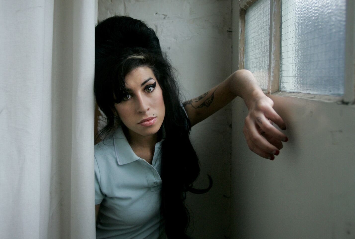Singer Amy Winehouse, 27, died in July 2011 from accidental alcohol poisoning. She was the first British female to win five Grammys.