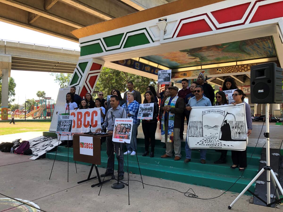 Members of the Southern Border Communities Coalition condemn Operation Gatekeeper and modern border policies on Oct. 1, 2019, on Gatekeeper's 25th anniversary at a Chicano Park news conference. Speaking is Pedro Rios, director of the U.S.-Mexico Border Program for the American Friends Service Committee.