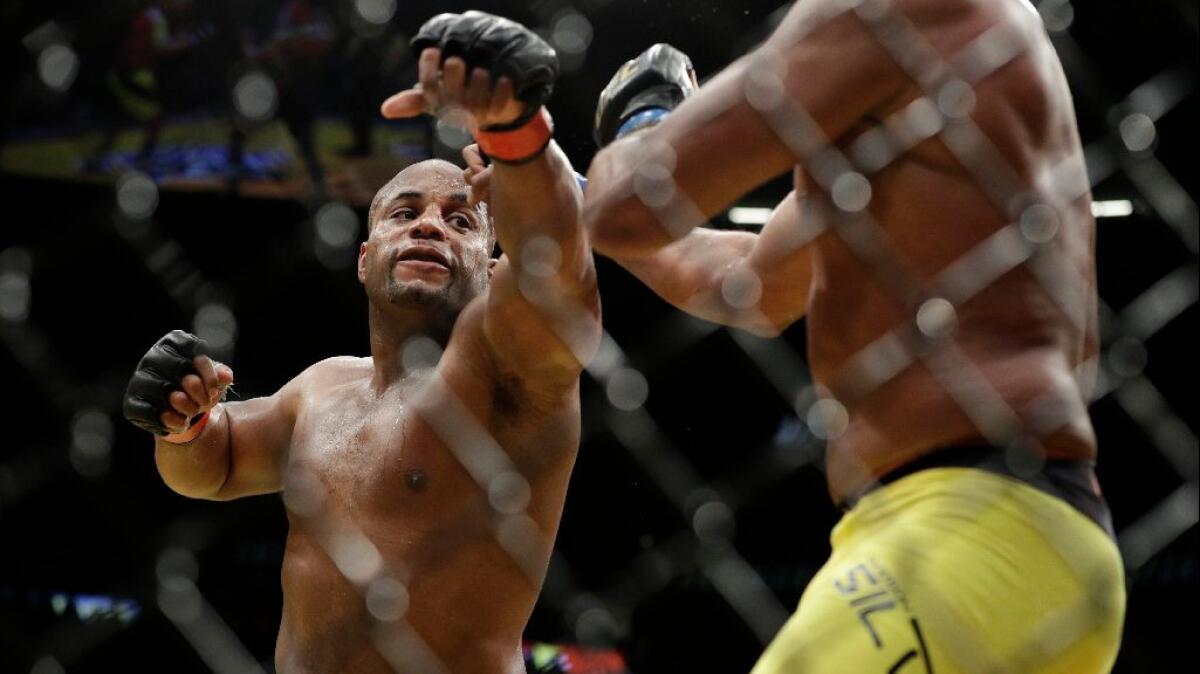 Daniel Cormier throws a punch at Anderson Silva during their fight at UFC 200 in Las Vegas on July 9.