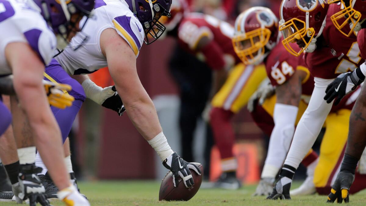 The Minnesota Vikings' and Washington Redskins' lines face off in a game Nov. 12.