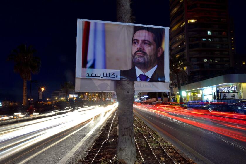Mandatory Credit: Photo by WAEL HAMZEH/EPA-EFE/REX/Shutterstock (9217959c) A photograph taken with low shutter speed shows a poster of Prime Minister Saad Hariri and Arabic words reading 'We are all Saad' hanging on a street in Beirut, Lebanon, 10 November 2017. Lebanese Prime Minister Saad Hariri Announced on 04 November 2017 that he resigns from the Prime Minister's office. According to media reports, Hariri said that the current political climate reminds him with the time before the assassination of his father, former Lebanese Prime Minister Rafic Hariri, and he also mentioned Iran's influence in his country, and the region. Hariri came into office for his second term on 18 December 2017. Resignation of Lebanese Prime Minister aftermath, Beirut, Lebanon - 10 Nov 2017 ** Usable by LA, CT and MoD ONLY **