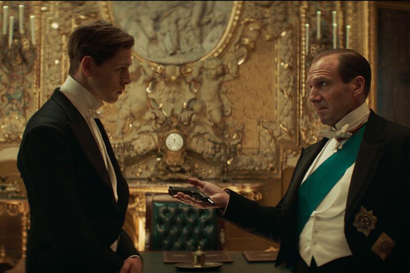 Harris Dickinson and ralph Fiennes in 'The King's Man.'