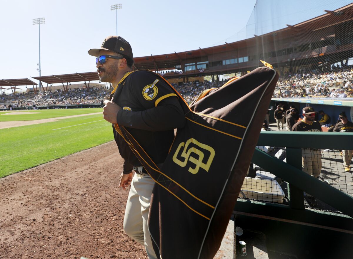 Trent Grisham leaves the dugout after playing in a spring training game against the White Sox on Feb. 25