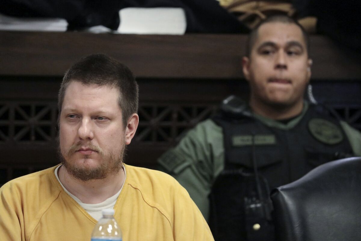 FILE - Chicago police Officer Jason Van Dyke, left, attends his sentencing hearing at the Leighton Criminal Court Building in Chicago, for the 2014 shooting of Laquan McDonald, Jan. 18, 2019. Van Dyke is scheduled to be released from prison on Thursday, Feb. 3, 2022, after he served less than half of his 81-month sentence. (Antonio Perez/Chicago Tribune via AP, Pool, File)